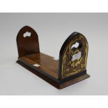 A Gothic style sliding book stand