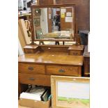 An Edwardian oak dressing table, fitted