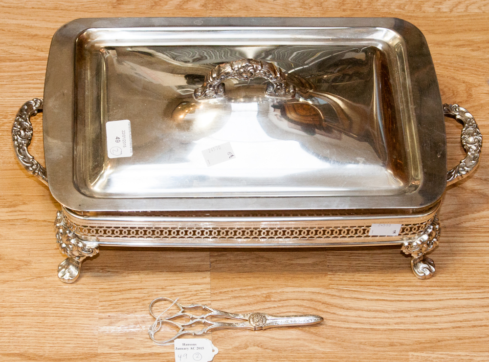 A large plated glass lined serving dish