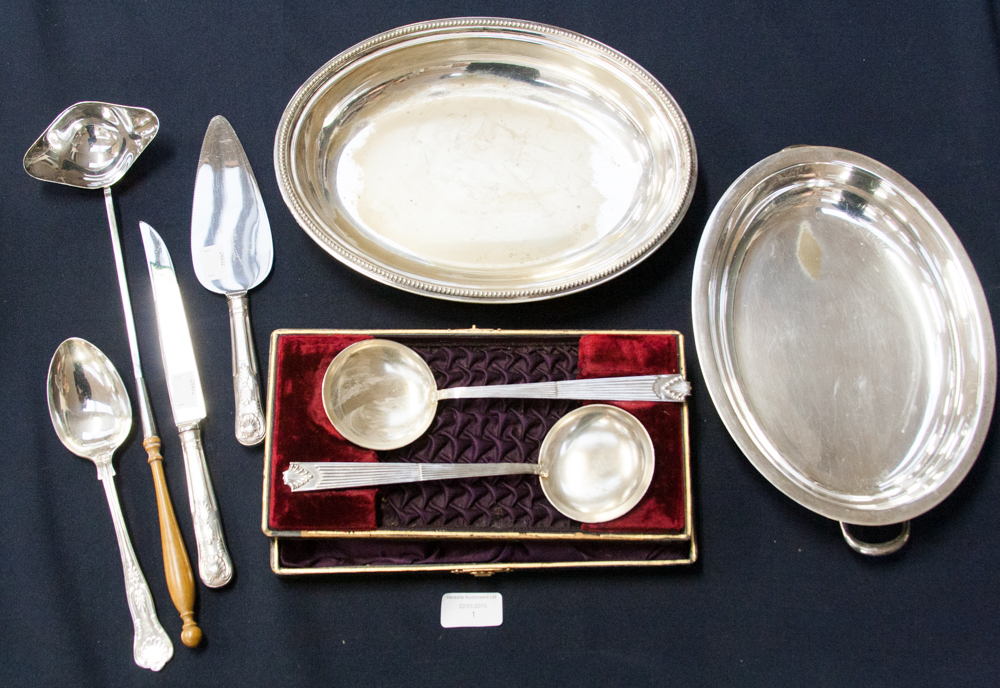 A pair of plated spoons in a case togeth