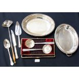 A pair of plated spoons in a case togeth