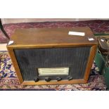 A 1950s wood veneered cased radio, Ambas