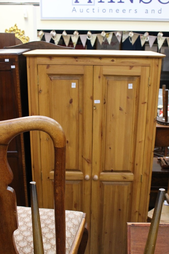 A pine two door wardrobe, together with