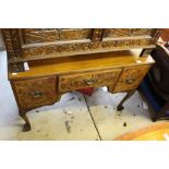 A 1920s walnut veneered dressing table