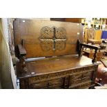 An early 20th Century oak Monks bench, c