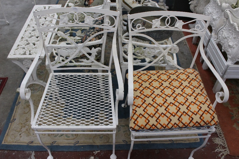 A white painted three part garden seat,