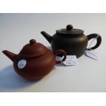 Two Yixing teapots