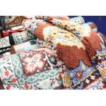 A large collection of rugs, thick pile,