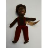 A Norah Wellings black doll, used as a M