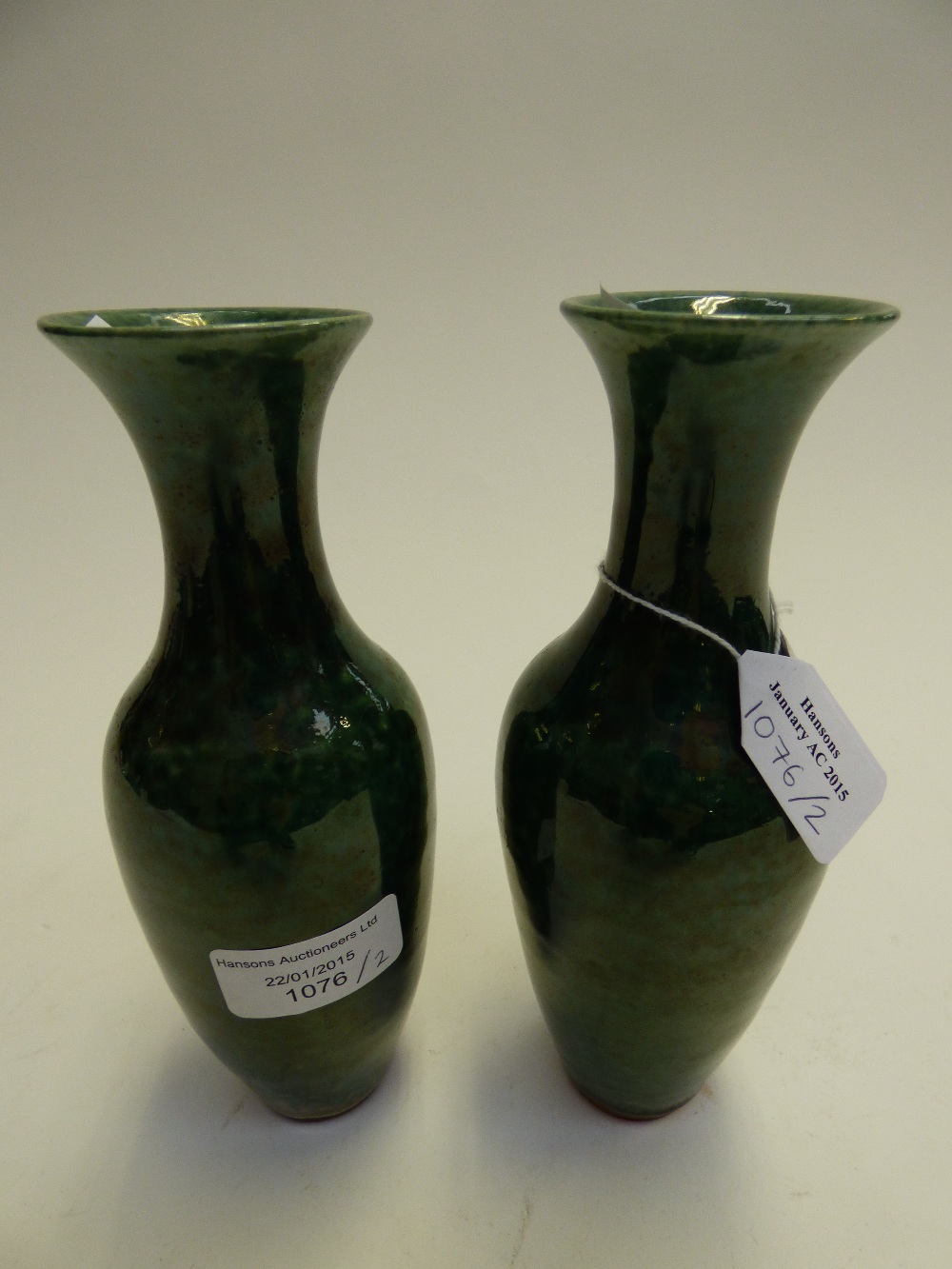 A pair of green Chinese vases, approx ea