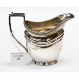 A George V silver cream jug, neo classic