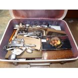 A suitcase of playing cards, cribbage bo