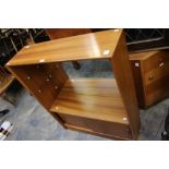 A 1970's teak veneered bookshelf, with s