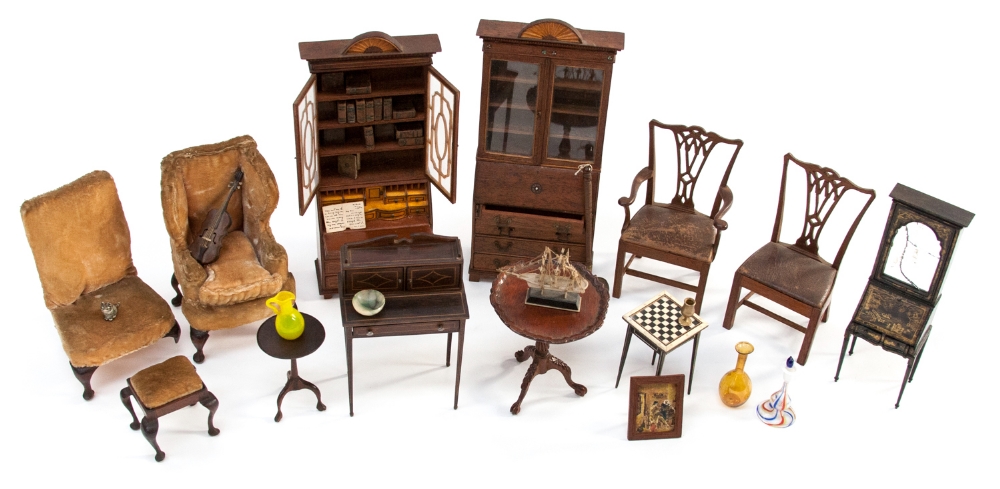 A collection of Edwardian dolls house furniture and furnishings, including Chippendale style chairs