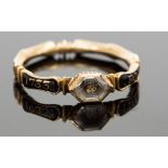 An 18th Century mourning ring, a picture of a skull beneath an octagonal faceted crystal, the band