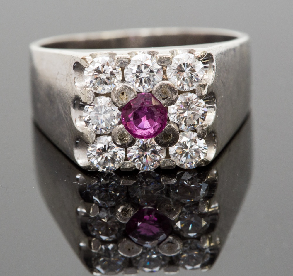 An 18ct white gold, ruby and diamond rin