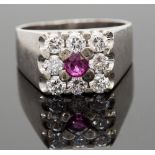 An 18ct white gold, ruby and diamond rin