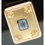 A French gold vinaigrette,the hinged cover set with a hardstone cameo carved depicting a winged