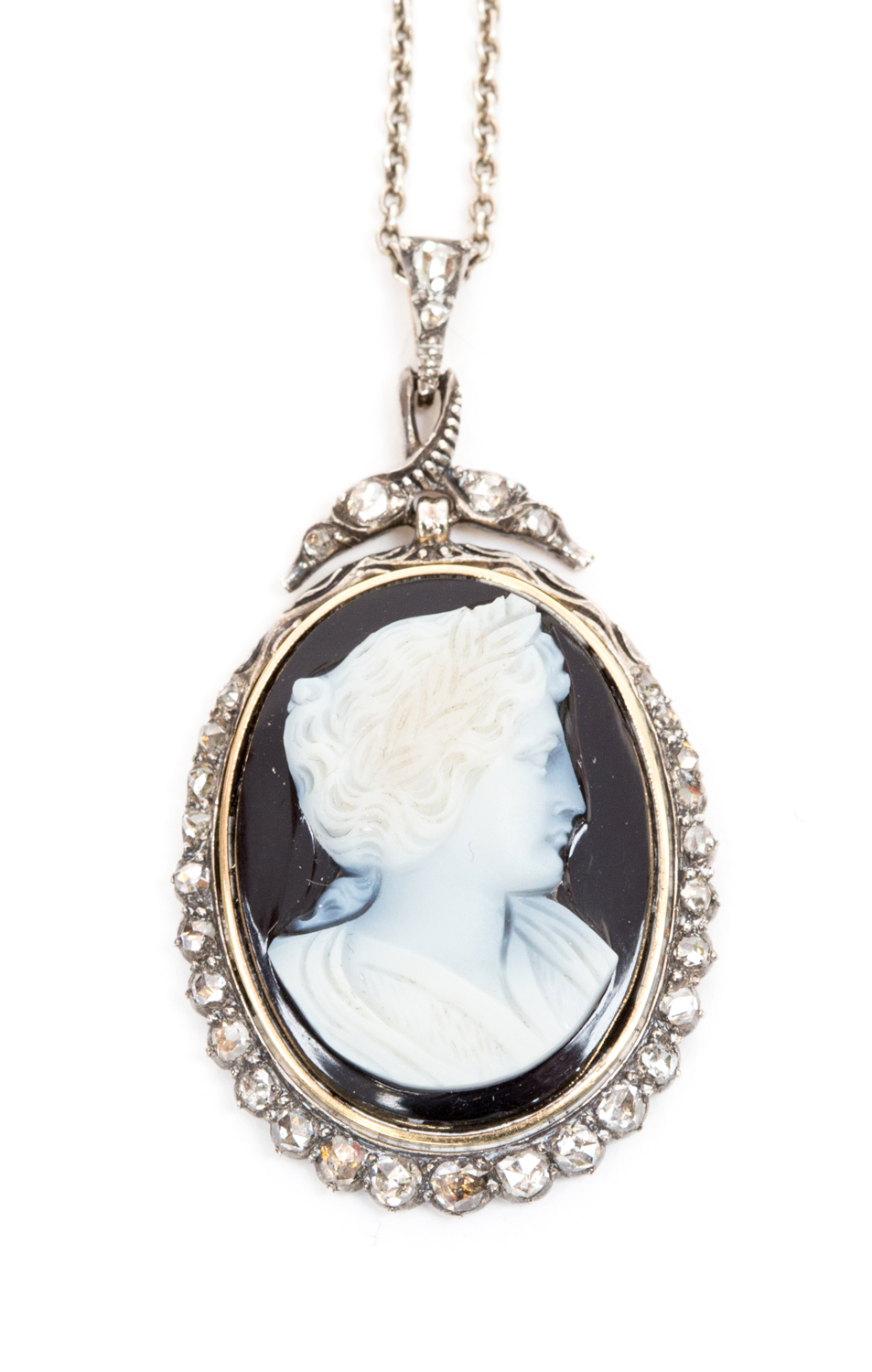 A 19th century hardstone cameo pendant, depicting a classical portrait with laurel wreath in hair,