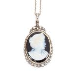 A 19th century hardstone cameo pendant, depicting a classical portrait with laurel wreath in hair,