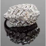 A platinum and diamond cocktail ring, the central stone approx 0.50ct, surrounded by trapeze and