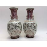 A pair of porcelain baluster Chinese vases, '52 sparrows' design, with elephant moulded handles,