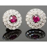 A pair of platinum, ruby and diamond earrings, the round-cut Burmese rubies approx 1.08cts total,