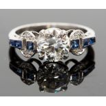 An Art Deco style platinum, diamond and sapphire ring, the round brilliant cut diamond approx 1.