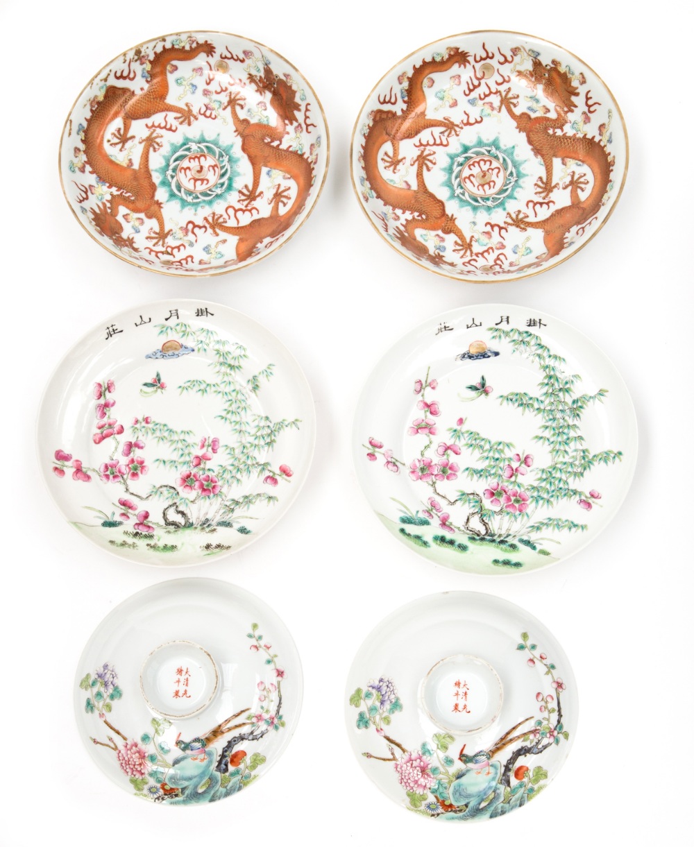 A collection of Chinese famille rose bowls and dishes, decorated with blossom, others with bats and