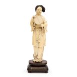 A 19th century Chinese carved ivory figure of a woman holding a mirror, on hardwood stand with