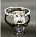An 18ct white gold and diamond solitaire ring, set with an emerald-cut diamond weighing 3cts, colour