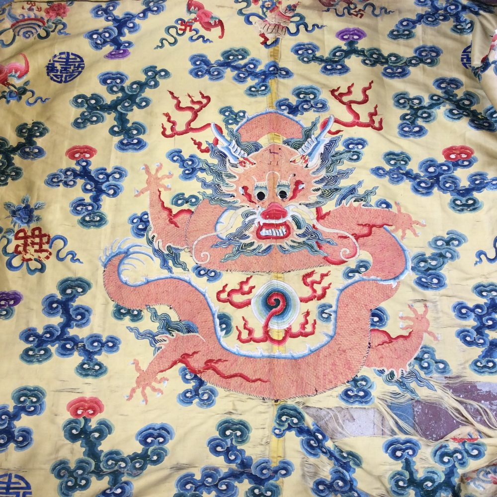 A 19th century Chinese silk embroidery, Imperial yellow ground with Imperial dragon to the centre,