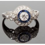 An Art Deco style platinum, sapphire and diamond ring, the central round brilliant-cut stone approx