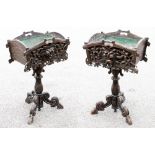 A pair of late 19th century, Edwards and Roberts, Black Forest planters, of pedestal form, the