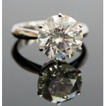 An impressive 18ct white gold and diamond solitaire ring, the round brilliant-cut stone weighing 6.