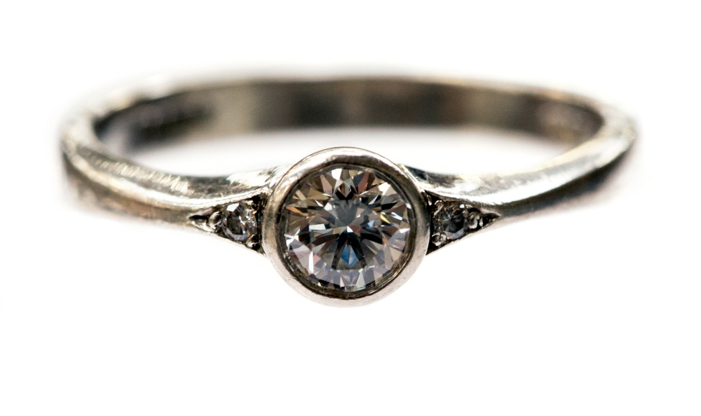 A platinum and diamond solitaire ring, the round cut brilliant stone approx 0.3ct, with two stones - Image 2 of 2