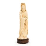 A 19th century Chinese carved ivory figure of a woman with rosary, holding a pearl, on a hardwood