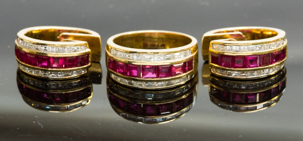 An 18ct gold ruby and diamond ring, size O, 8.3g; together with a matching pair of earrings, 14.8g