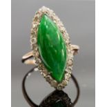 An Edwardian jadeite and diamond ring, set with a marquise jadeite cabachon, surrounded by diamonds,