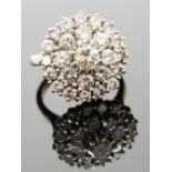 **amended total diamond weight** A diamond cluster ring, set with twenty-five graduated round