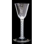 An opaque twist wine glass, the round funnel bowl on a multi series spiral stem with central mesh