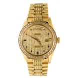 A gentleman's Rolex 18ct gold Day-Date wristwatch, day and date apertures, set with diamonds and