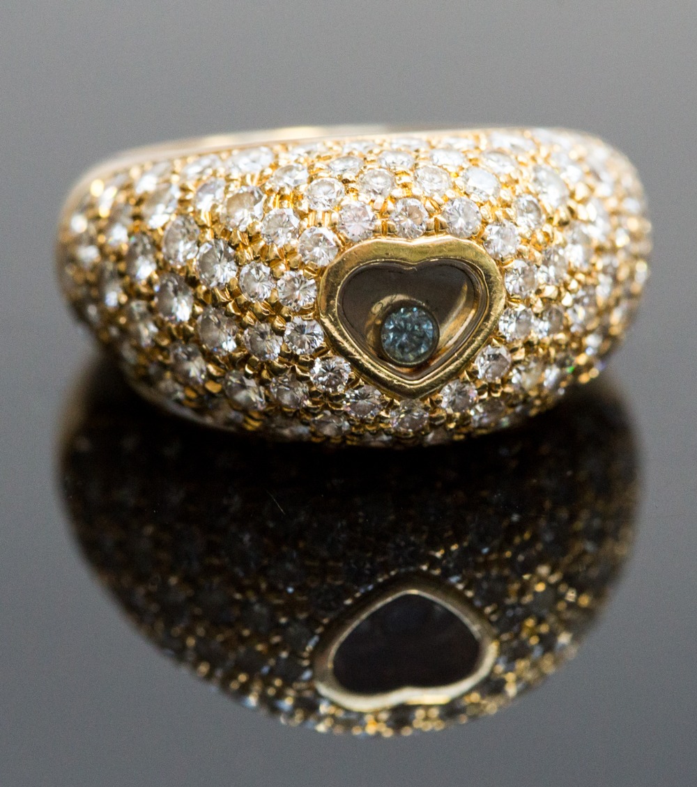 Chopard, 18ct gold Happy Diamonds ring, the central heart set with a fancy blue diamond, the shank