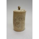 A 19th century carved ivory lidded tusk