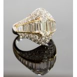 An 18ct gold and diamond dress ring, central baguette-cut diamond approx 1.80ct, pave set with