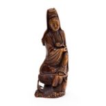 A Chinese stained ivory carved figure of a woman with sceptre and rosary, on carved plinth, 20cm