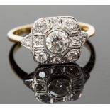 An 18ct gold and diamond ring, the central round brilliant-cut stone surrounded by smaller stones,