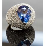 A bombe sapphire and diamond cocktail ring, set with a pear shaped sapphire approx 10cts, the