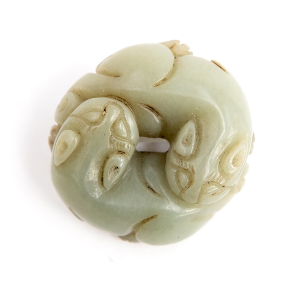 A carved jade pendant disc of two cats e