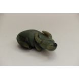 A jade carving of a buffalo,in crouching